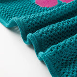 Close-up of teal floral mesh beach sweater crochet top with pink flower detail by Trendsi