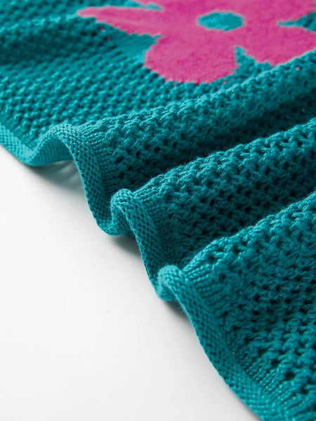 Close-up of teal floral mesh beach sweater crochet top with pink flower detail by Trendsi