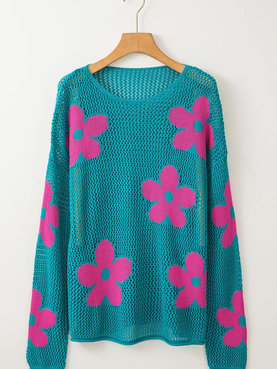 Trendsi floral mesh beach sweater crochet top in teal with pink flower patterns hanging on wooden hanger