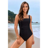 Beach Babes floral one piece swimsuit black slim fit design worn by smiling woman at the beach