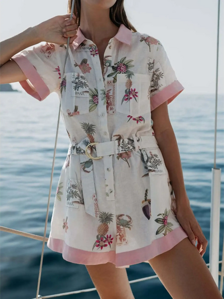 Trendsi floral resort romper for women with short sleeves and belted waist near ocean