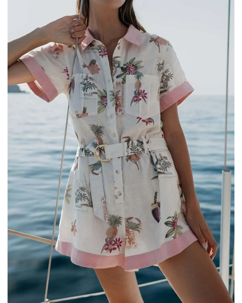 Trendsi floral resort romper for women with short sleeves and belted waist near ocean