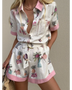 Trendsi floral resort romper for women with pink trim and tropical print on lightweight fabric
