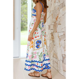Trendsi maxi dress featuring a colorful floral resort wear dress pattern with blue trim and spaghetti straps