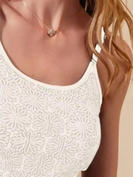 Close-up of Babe Beachwear floral seamless tank top in white with textured flower pattern