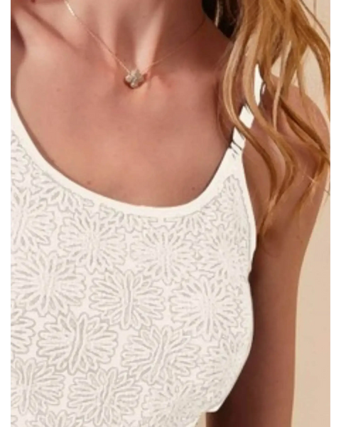 Close-up of Babe Beachwear floral seamless tank top in white with textured flower pattern