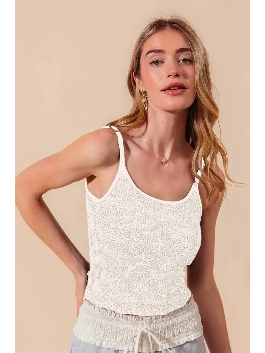 Babe Beachwear floral seamless tank top in white worn by model with light hair and beige background