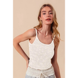 Babe Beachwear floral seamless tank top in white worn by model with light hair and beige background