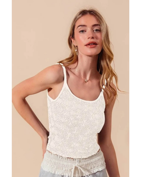 Babe Beachwear floral seamless tank top in white worn by model with light hair and beige background