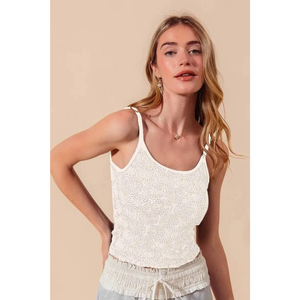 Babe Beachwear floral seamless tank top in white worn by model with light hair and beige background