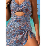 Beach Babes sexy cutout swim dress with floral print and side tie detail by the ocean