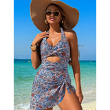 Beach Babes sexy cutout swim dress with floral print and halter neckline worn on the beach