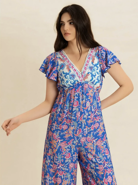 Trendsi floral wide leg jumpsuit for vacation with blue and pink pattern and flutter sleeves