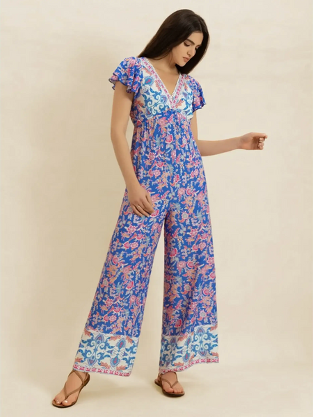 Trendsi floral wide leg jumpsuit for vacation with blue and pink floral print and flutter sleeves