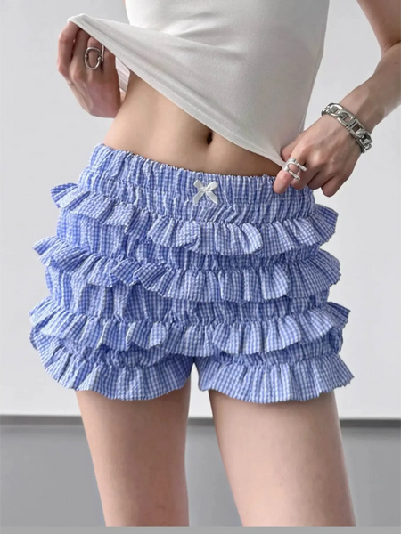woman wearing Babe Beachwear casual shorts with flouncy Ruffle bottoms for women and teens in blue checkered pattern