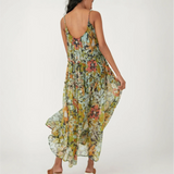 Trendsi flowy maxi dress for beach with floral print and thin straps shown from the back