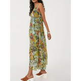 Trendsi flowy maxi dress for beach in green floral pattern worn with brown platform sandals