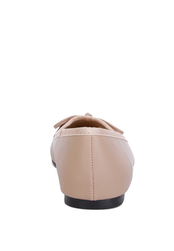Rag Company nude and silver ballet flats shown from the back with bow detail and black sole
