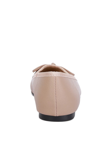 Rag Company nude and silver ballet flats shown from the back with bow detail and black sole