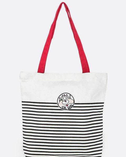 Studio image Babe Beachwear girl gang canvas tote bag with black stripes and red handles