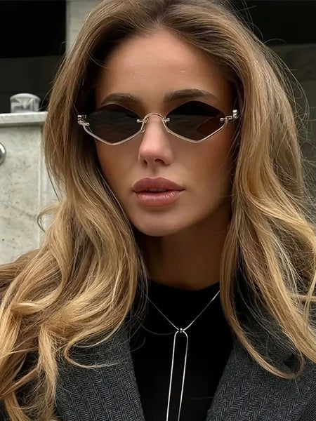 Trendsi glamorous vacation sunglasses with unique geometric black lenses worn by a woman with long blonde hair