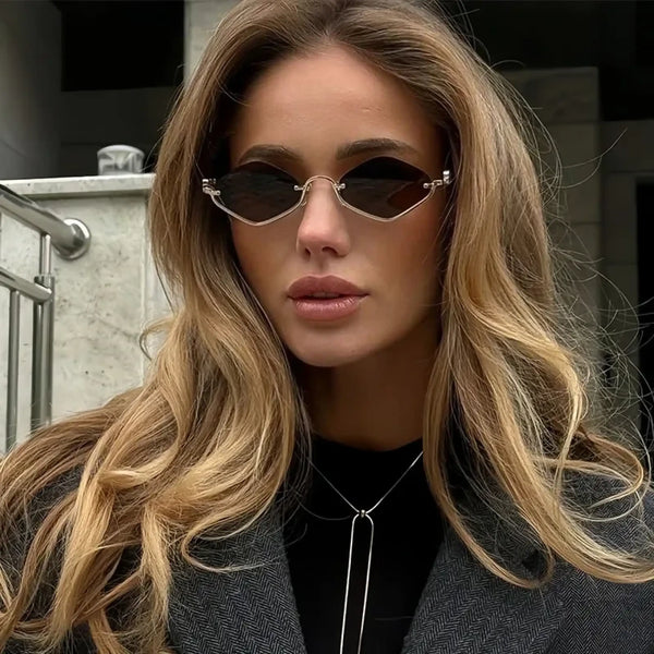 Trendsi glamorous vacation sunglasses with unique geometric black lenses worn by a woman with long blonde hair