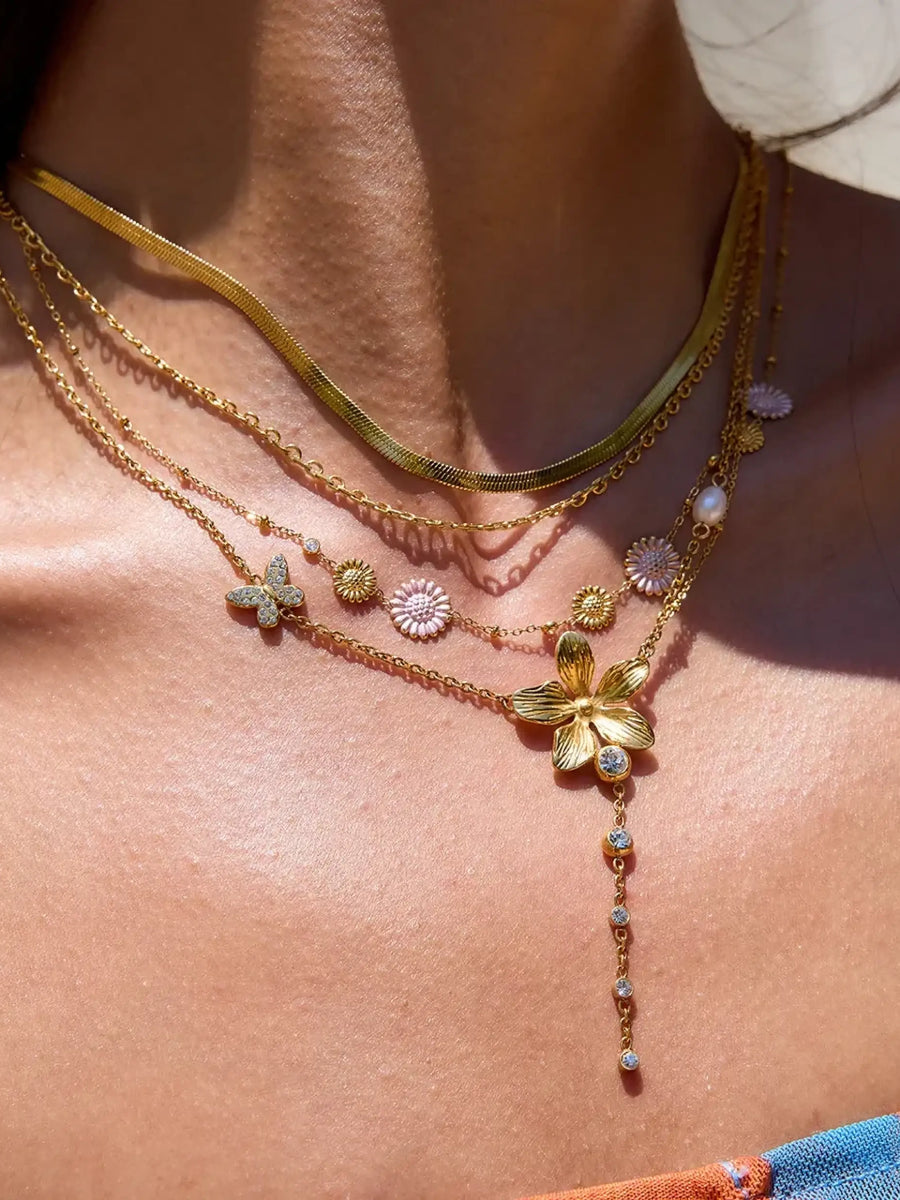 Trendsi 3 piece flower layer chain necklace in gold with floral charms and delicate design
