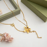 Trendsi 3 piece flower layer chain necklace with gold flower pendant and delicate butterfly charm