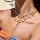 Trendsi 3 piece flower layer chain necklace with gold chains and floral charms on model