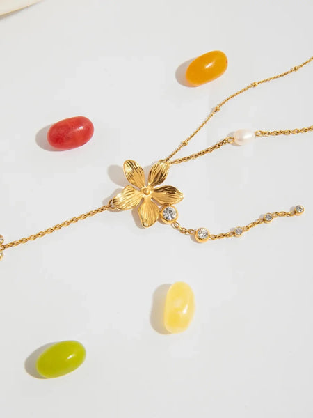 Trendsi 3 piece flower layer chain necklace in gold with pearl and crystal accents on white background