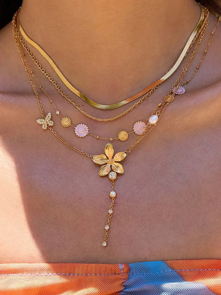Trendsi 3 piece flower layer chain necklace in gold with flower and butterfly charms on model