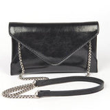 Black envelope clutch bag for women with silver chain strap by Babe Beachwear