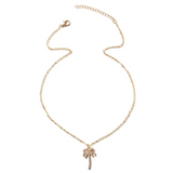 Gold palm tree pendant necklace from Trendsi with delicate chain and sparkling stones