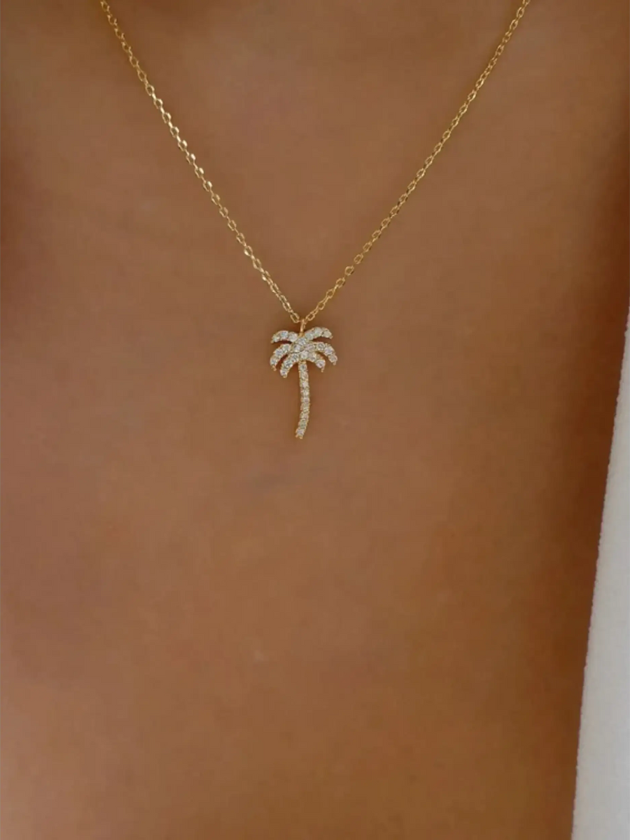  gold palm tree pendant necklace with sparkling stones on delicate chain