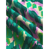 Close-up of colorful fabric pattern for blue batwing romper for travel by Babe Beachwear