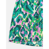 Close-up of colorful fabric pattern on Babe Beachwear blue batwing romper for travel