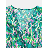 Babe Beachwear blue batwing romper for travel with vibrant green and pink abstract pattern
