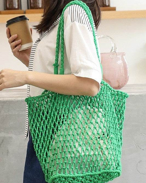 Miss Sparkling green braided net beach tote carried by woman with coffee cup and casual outfit