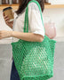 Miss Sparkling green braided net beach tote carried by woman with coffee cup and casual outfit