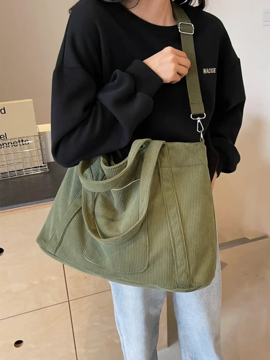 Babe Beachwaer lightweight Ladies duffle bag in olive green corduroy fabric carried on shoulder