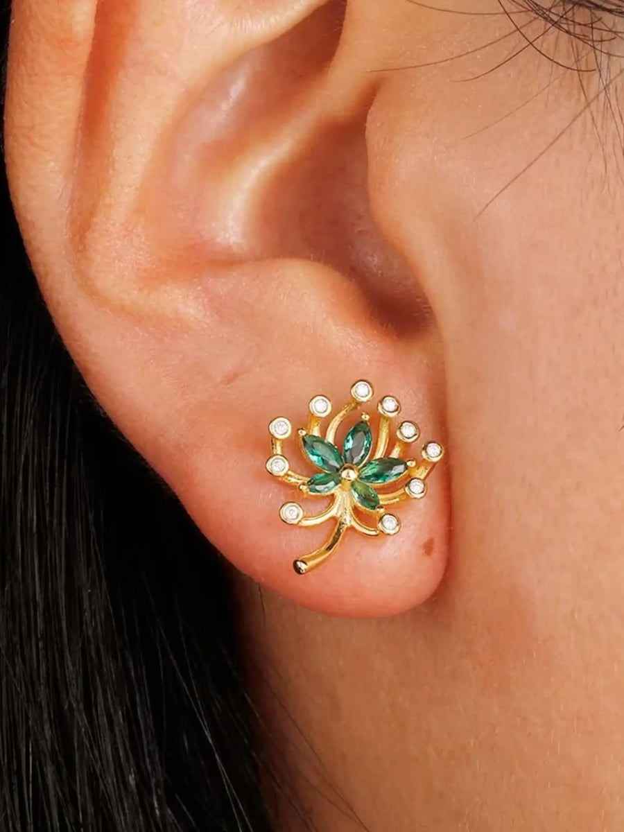 Green Palm Leaves Stud Earrings on ear with gold and green gemstone design