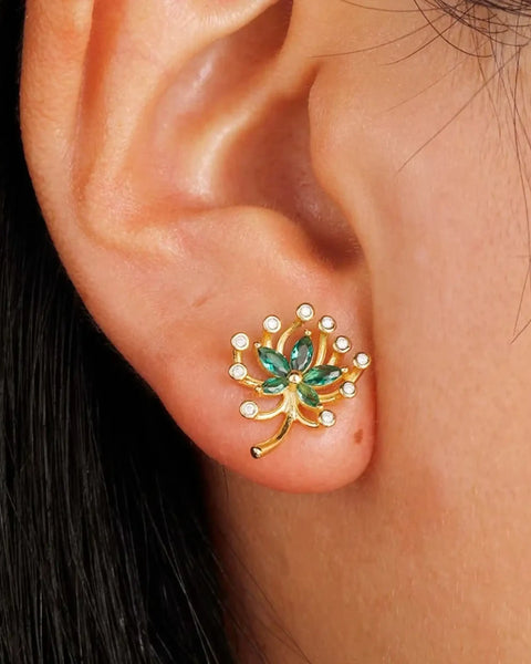 Green Palm Leaves Stud Earrings on ear with gold and green gemstone design