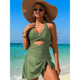 Beach Babes sexy cutout swim dress in olive green with halter neck and side tie detail on beach
