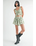 Emory Park green tropical flutter shorts with matching sleeveless top worn with black boots and sunglasses