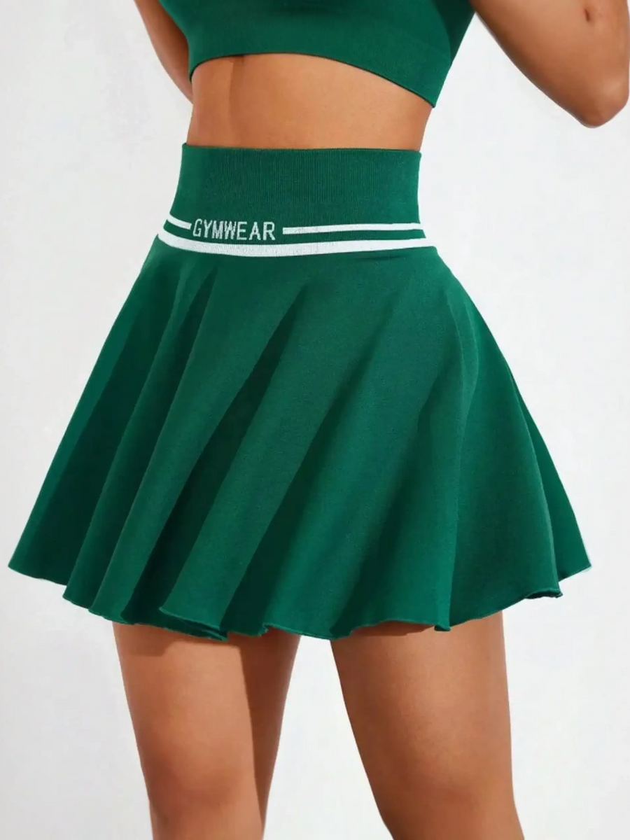 Green tennis skirt by Trendsi featuring a wide waistband and pleated design for women's athletic skort summer