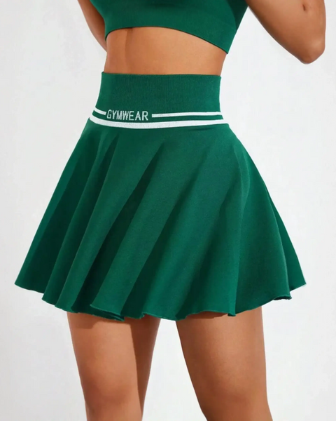 Green tennis skirt by Trendsi featuring a wide waistband and pleated design for women's athletic skort summer