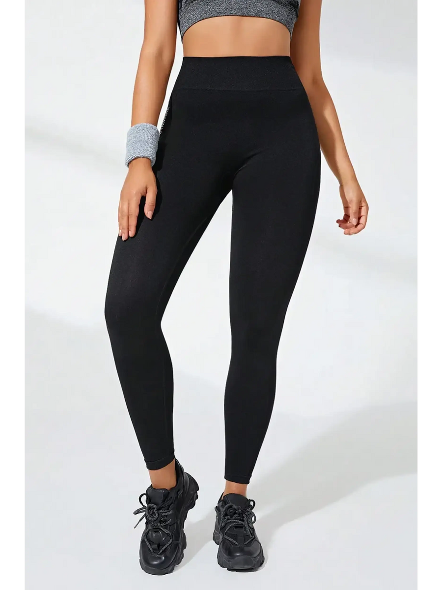 Babe Beachwear black high waisted leggings styled with black sneakers and gray crop top