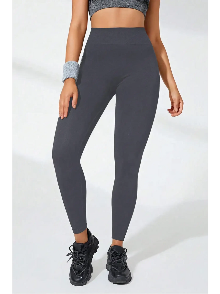Babe Beachwear black high waisted leggings with fitted design worn with black sneakers