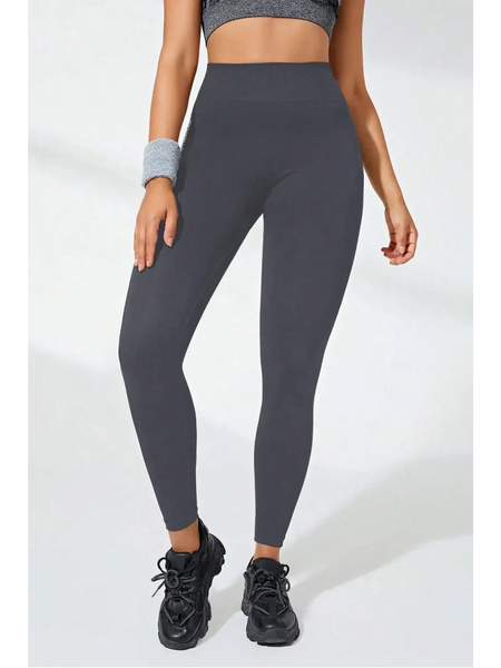 Babe Beachwear black high waisted leggings with fitted design worn with black sneakers