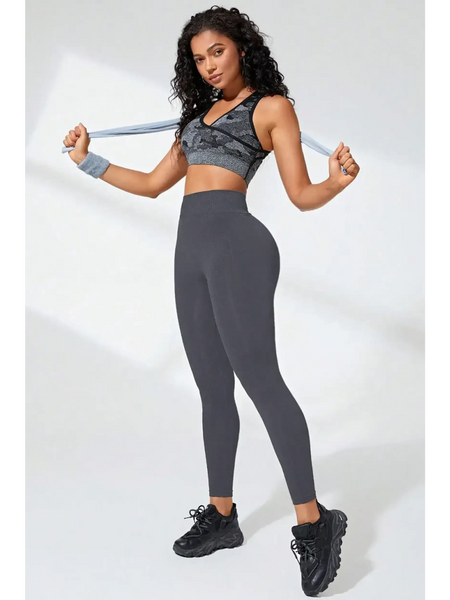 Babe Beachwaer black high waisted leggings worn by model with athletic top and black sneakers